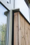Aansluiting aluminium kozijnen gevelbekleding