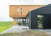 Houtenhuismetregenpijpingevel